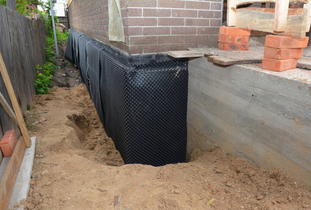 SJ Waterproofing Pros technician performing targeted Waterproofing assessment in New Lisbon, WI